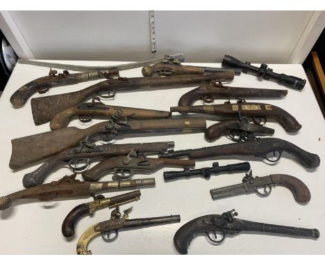 A box full of assorted vintage wall hanging pistols etc a/f, shipping unavailable