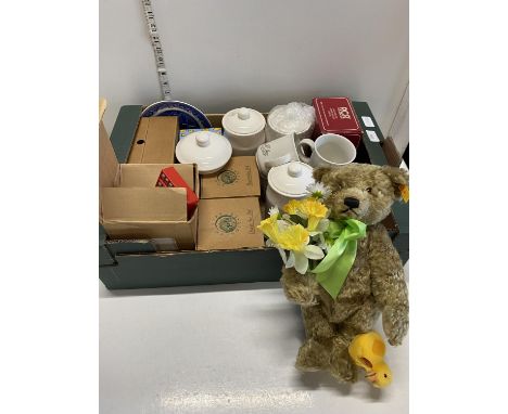 A box full of assorted collectibles including a Steiff bear 654646