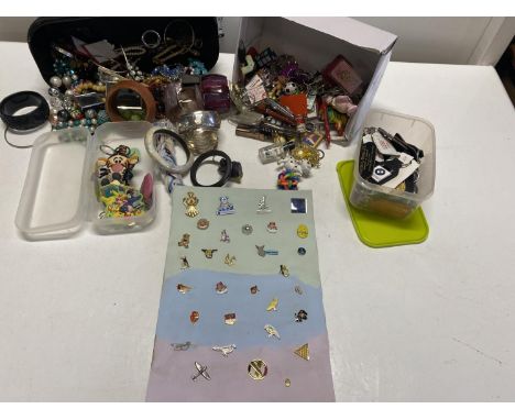 A selection of assorted enamel badges, keyrings and other