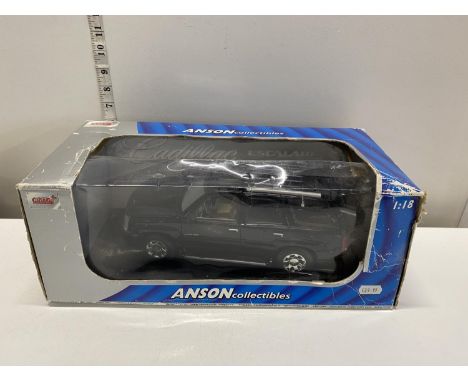 A boxed Anson 1:18 scale Cadillac Escalade die-cast model