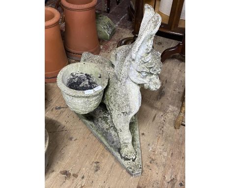 A large concrete garden planter in the form of a donkey. 90cm tall. No shipping