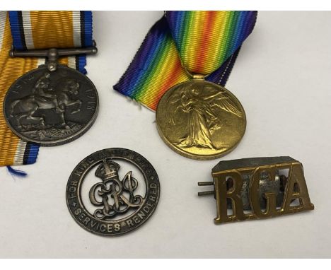 Two WW1 medals awarded to 59387 Gunner F Neal of The Royal Artillery and two other associated badges