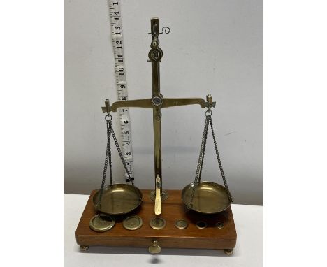A pair of post office scales complete with weights, shipping unavailable