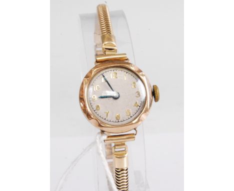 A 9ct gold cased lady's manual wind wristwatch (overwound), case dia.22mm, on gold plated bracelet