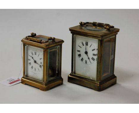 An early 20th century French lacquered brass carriage clock, h.11.5cm; together with one other smaller example (2)