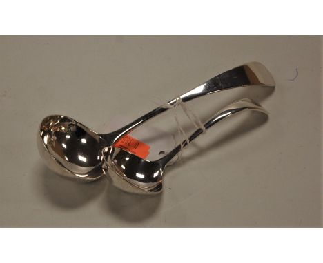 A modern sauce ladle; together with one other smaller matching example (2)