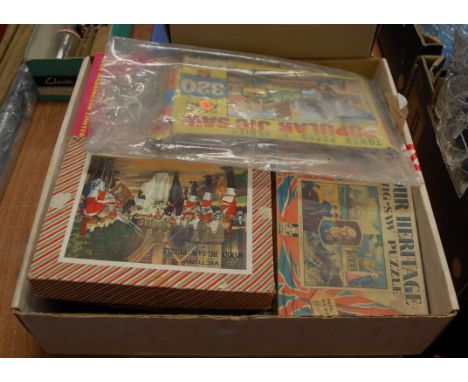 A mixed lot to include various jigsaw puzzles, matchboxes, tea cards, clock movement, a Bayko building set etc