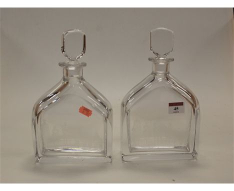 A pair of Orrefors glass decanters and stoppers, each etched with hunting scene and signed Felix White, h.25cm