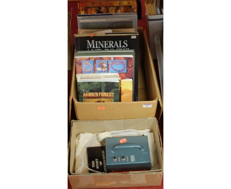A collection of various books relating to rocks, minerals, fossils and their identification, together with an ultra violet la