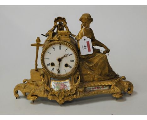 A late 19th century continental gilt metal and porcelain inset mantel clock, with associated plinth