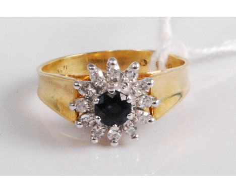 An 18ct gold, blue and white sapphire set flower head cluster ring, 4.8g, size M