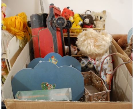 A wooden children's ride-on model steam engine, together with various teddy bears, dolls, and other toys