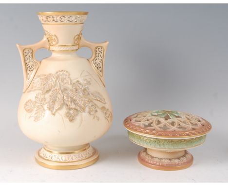 A Worcester porcelain blushware vase, having reticulated handles, applied leaf, fruit and flower decoration, heightened in gi