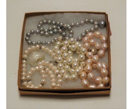 A modern cultured grey pearl single string knotted necklace, 49cm; together with three other modern cultured pearl necklaces 