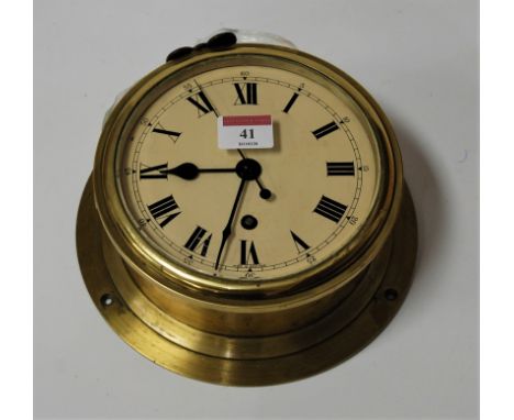 An F.W. Elliott Ltd of Croydon brass cased ships clock, 21cm