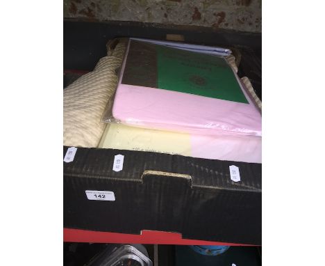 A box of sheets and curtains 