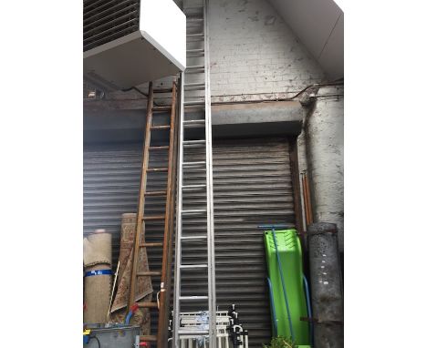 A large extending aluminium ladder. 