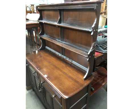 An Ercol dark elm dresser. 