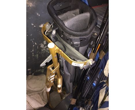 An Ace golf trolley and Dunlop golf bag. 