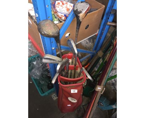 A vintage Dunlop golf bag with various clubs 