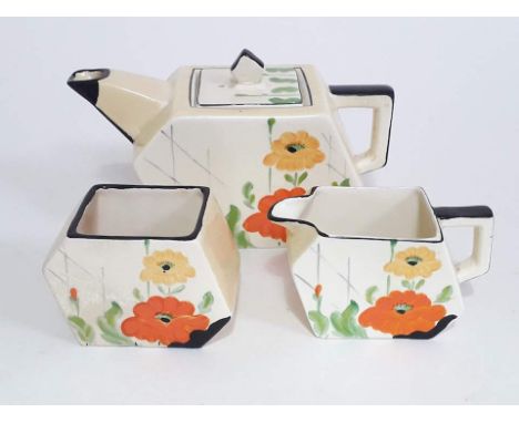 A Midwinter Art Deco pottery three piece tea set. Condition - restoration to teapot spout and cream jug handle. 