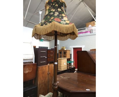 A stained beech standard lamp. 