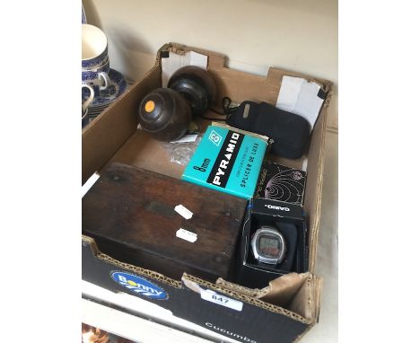 A box of misc items to include a wooden box of watchmaker's tools, a Casio watch, a Olympus camera, a splicer, green bowls, e