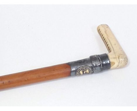 A Victorian malacca walking stick with carved ivory handle and white metal collar with gilt label inscribed 'Godfrey Gottschl