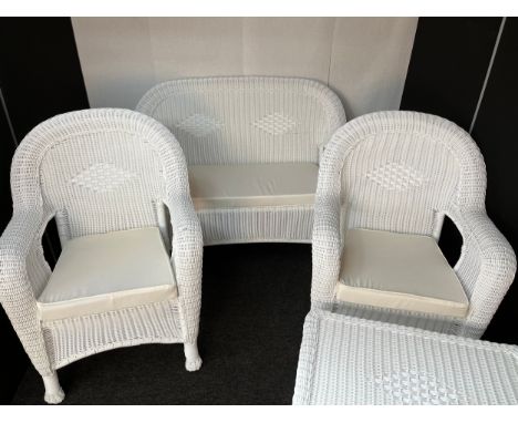 Contemporary three piece plastic weaved garden set with matching table. 