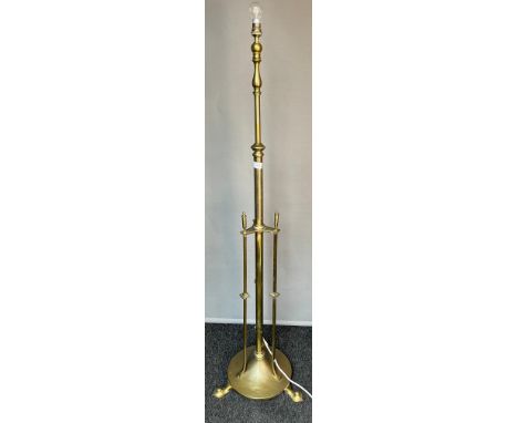 An Art Nouveau brass Rise and Fall floor standing lamp [150cm high] 