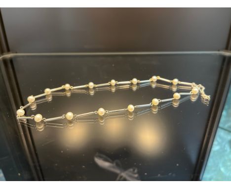A 9ct white gold and pearl necklace [38cm in length] [7.50grams] 