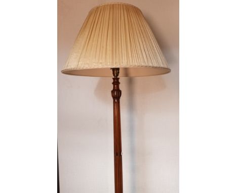 Antique free standing lamp, the carved central column raised on tri outswept legs ending in claw and ball feet [58cm-wooden c