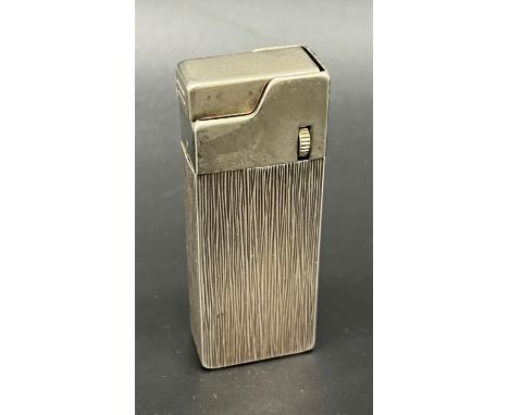 A Vintage Sterling silver cased lighter 