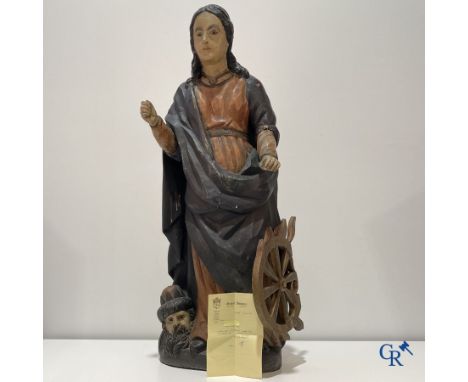 Religious objects, An imposing wooden sculpture of Saint Catherine with the head of Emperor Maxentius. With a purchase invoic