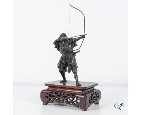 Asian Art, Japanese art, a bronze representation of a Samurai archer on a wood-carved pedestal. Signed. Meiji period. | 49 x 
