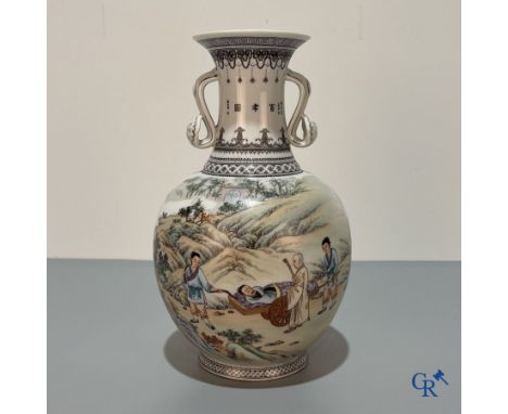 Asian Art, A Chinese vase with a decor of characters in a landscape and calligraphy. 20th century. | Height: 30 cm.
