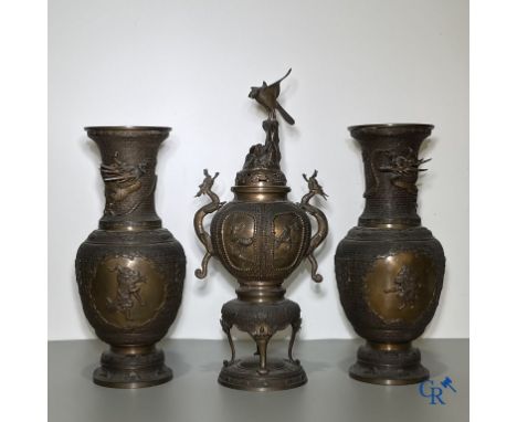 Asian Art, A Japanese finely crafted koro with birds and dragons and a pair of bronze vases. Signed. | Koro: 56 cm.Vases: 46 