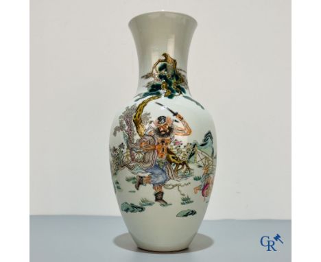 Asian Art, Chinese porcelain, a Chinese famille rose vase with warriors. | Height: 35.5 cm. | Condition: Hairline at the top.