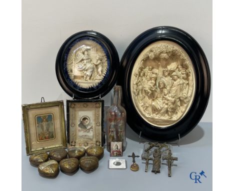 A lot with various religious objects and brocante. Including 2 large frames in sepiolite, several ex voto hearts (souvenir of