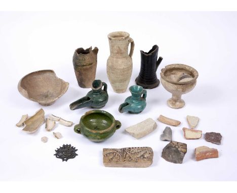 Antiquities:- A collective lot of approximately fifteen pieces including tile fragments, pottery jugs, shards etc (c15)