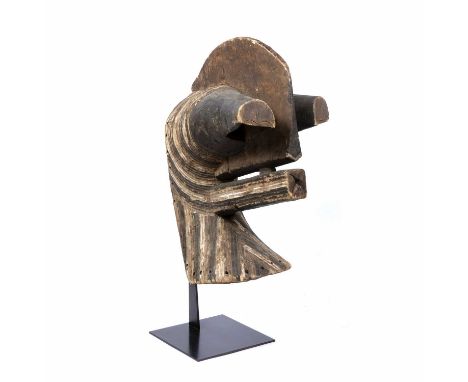 A 20th century male Kifwebe, Songye mask with stand, wood carved with central tall upstanding comb, protruding eyes and squar
