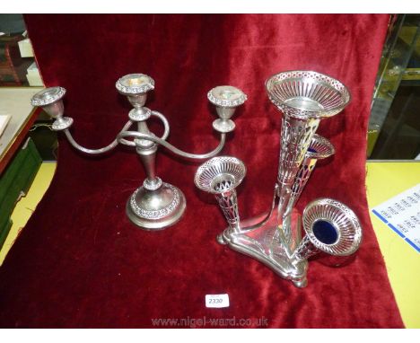 A silver plated Epergne with blue glass inserts, one a/f, and a three branch candelabra.