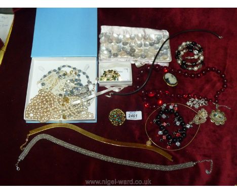 Two boxes of costume jewellery to include a pearl choker, brooches, necklaces, 'Monaco' brooch etc.