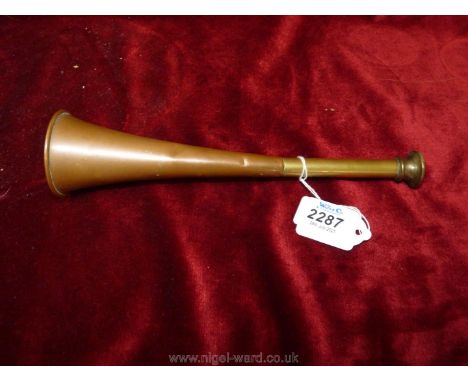 A small brass and copper hunting horn.