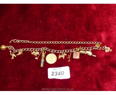 A gold Charm Bracelet including several charms and 1907 half-sovereign, plus another link chain, 40.6 grams. Further informat