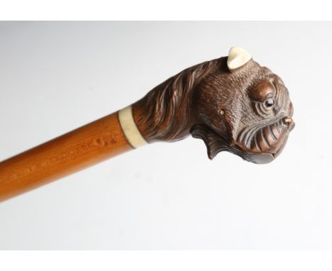 A 19th century satin birch walking cane, the carved softwood automated handle modelled in the form of a boxer dog with small 