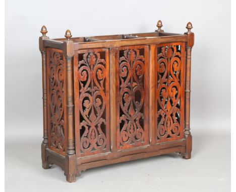 A late Victorian walnut three-division stick stand with pierced fretwork panels, height 76cm, width 77cm, depth 30cm.Buyer’s 