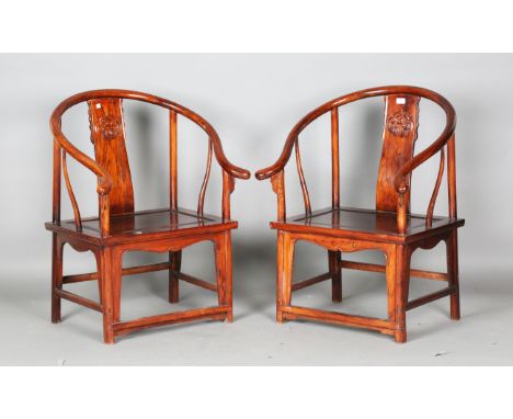 A pair of Chinese stained elm horseshoe back armchairs with solid panel seats, height 90cm, width 68cm, depth 57cm.Buyer’s Pr