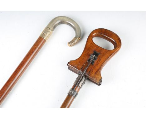 A late 19th century rosewood walking stick with horn handle and gilt metal foliate embossed mounts, length 92cm, and a faux b