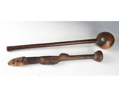 An early 20th century lignum vitae knobkerrie, length 60cm, and an African wooden fertility stick with bulbous end, length 48